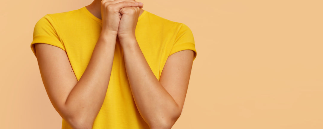 hands being held together and close to face